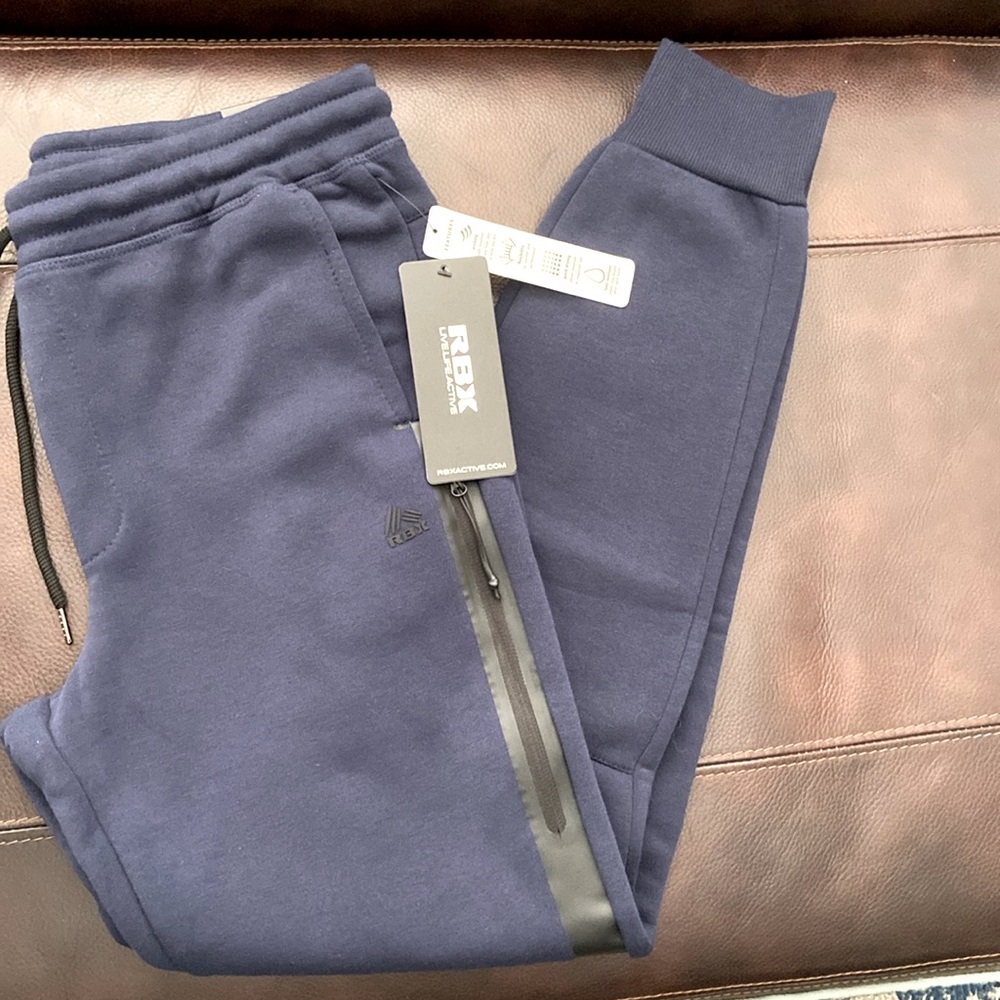 NWT men's dark blue RBX brand joggers, size M.